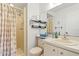 Functional bathroom featuring a shower and vanity with organized storage at 12804 Wedgewood Way # C, Hudson, FL 34667