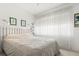 Inviting bedroom offers a calm ambiance with soft light and neutral decor at 12804 Wedgewood Way # C, Hudson, FL 34667