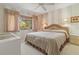 Serene bedroom with a plush bed, ample natural light, and soothing decor at 12804 Wedgewood Way # C, Hudson, FL 34667