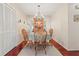 Dining area with table, chandelier and hardwood floors at 12804 Wedgewood Way # C, Hudson, FL 34667