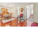 Dining area with wood table set, complemented by hardwood floors and classic decor at 12804 Wedgewood Way # C, Hudson, FL 34667