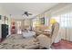 Spacious living room featuring hardwood floors, ample lighting, and stylish decor at 12804 Wedgewood Way # C, Hudson, FL 34667