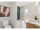 Bathroom boasts modern tile work, double sinks and large tub at 13211 111Th Ln, Largo, FL 33778