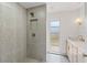 Modern bathroom featuring tiled shower, niche and a stylish vanity with gold fixtures at 13211 111Th Ln, Largo, FL 33778