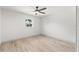 Bright, clean bedroom with wood-look floors and a ceiling fan at 13211 111Th Ln, Largo, FL 33778