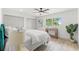 Bedroom features double closets, ceiling fan, and large window at 13211 111Th Ln, Largo, FL 33778