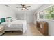 Bedroom showing large closet, modern ceiling fan, and large window at 13211 111Th Ln, Largo, FL 33778