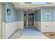 Inviting entryway showcasing stylish exterior lighting, clear address numbers, and modern design elements at 13211 111Th Ln, Largo, FL 33778