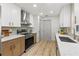 Modern kitchen with two-tone cabinets, stainless steel appliances, and stylish countertops at 13211 111Th Ln, Largo, FL 33778