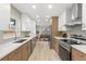 Spacious kitchen with white and wood cabinets and stainless steel appliances at 13211 111Th Ln, Largo, FL 33778