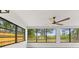 Bright sunroom with large windows offering serene views of the outdoors and natural light at 13211 111Th Ln, Largo, FL 33778