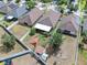 An aerial view of the property shows a well-maintained yard and outdoor features at 14233 Edinburgh Moor Dr, Wimauma, FL 33598