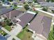 An aerial view showcases this charming single-Gathering home in a suburban neighborhood at 14233 Edinburgh Moor Dr, Wimauma, FL 33598