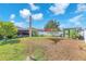 Landscaped backyard featuring lush green grass and privacy fence at 14233 Edinburgh Moor Dr, Wimauma, FL 33598