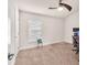 Neutral-toned bedroom with window and a beige carpet at 14233 Edinburgh Moor Dr, Wimauma, FL 33598