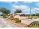 Ayersworth community entrance sign, with lush landscaping at 14233 Edinburgh Moor Dr, Wimauma, FL 33598