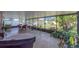 Covered patio with lots of plants and a beautiful backyard view at 14233 Edinburgh Moor Dr, Wimauma, FL 33598