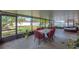 Enclosed patio with seating and view of the beautifully maintained backyard at 14233 Edinburgh Moor Dr, Wimauma, FL 33598