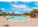 Spacious community pool features a brick patio, clear blue water, and plenty of space for relaxation at 14233 Edinburgh Moor Dr, Wimauma, FL 33598