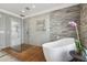 Stylish bathroom showcases a glass-enclosed shower, sleek fixtures, and a freestanding tub, creating a modern spa at 157 9Th N Ave, St Petersburg, FL 33701