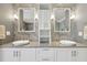 Modern bathroom with dual vessel sinks, granite countertops, and decorative mirrors, offering a clean and stylish design at 157 9Th N Ave, St Petersburg, FL 33701