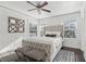 Inviting bedroom with a tufted headboard, geometric rug, and bright windows, offering a comfortable and stylish space at 157 9Th N Ave, St Petersburg, FL 33701