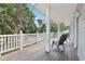 Wide deck area featuring outdoor chairs and a view of the street and nearby trees at 157 9Th N Ave, St Petersburg, FL 33701