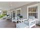 Inviting front porch with cozy seating, creating a relaxing outdoor space to enjoy the neighborhood views at 157 9Th N Ave, St Petersburg, FL 33701