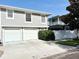 Modern home with a two-car garage and well-maintained landscaping at 157 9Th N Ave, St Petersburg, FL 33701