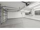 Spacious garage featuring sealed floor, painted walls, built-in storage, and modern lighting at 157 9Th N Ave, St Petersburg, FL 33701