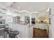 Modern kitchen with granite counters, stainless steel appliances, a breakfast bar and views of the living room at 157 9Th N Ave, St Petersburg, FL 33701