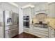 Modern kitchen with stainless steel appliances, including a large refrigerator and double wall ovens at 157 9Th N Ave, St Petersburg, FL 33701