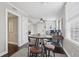 This open living area features hardwood floors, a ceiling fan, and access to another room at 157 9Th N Ave, St Petersburg, FL 33701