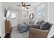 This living room has a mounted tv, comfortable seating, and great natural light at 157 9Th N Ave, St Petersburg, FL 33701