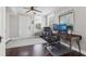 This office features hardwood floors, a ceiling fan, and a large computer setup at 157 9Th N Ave, St Petersburg, FL 33701
