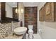 Chic powder room features a vessel sink, unique wooden accent wall, and modern lighting, adding a touch of elegance at 157 9Th N Ave, St Petersburg, FL 33701