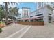Outdoor dining area at a charming restaurant with red and white striped umbrellas at 157 9Th N Ave, St Petersburg, FL 33701