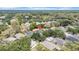 Aerial view of the property nestled among lush trees in a quiet neighborhood at 15810 Starling Water Dr, Lithia, FL 33547