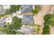 Aerial view showcases roof and surrounding trees in neighborhood at 15810 Starling Water Dr, Lithia, FL 33547