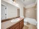 Well-lit bathroom boasts a single sink vanity and a shower-tub combo at 15810 Starling Water Dr, Lithia, FL 33547