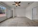 This carpeted bedroom features a window, ceiling fan, and an ensuite bathroom for convenience at 15810 Starling Water Dr, Lithia, FL 33547