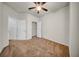 Spacious bedroom featuring neutral paint, carpet, closet, and ceiling fan at 15810 Starling Water Dr, Lithia, FL 33547
