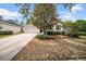 Charming single-story home featuring a lush front yard and attached two-car garage at 15810 Starling Water Dr, Lithia, FL 33547