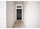 A modern black front door with sidelight provides a secure welcome at 15810 Starling Water Dr, Lithia, FL 33547