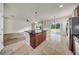 Kitchen island in a bright, open-concept home with access to the living room and backyard at 15810 Starling Water Dr, Lithia, FL 33547