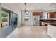 Eat-in kitchen features tile flooring, access to the backyard, and stainless steel appliances at 15810 Starling Water Dr, Lithia, FL 33547