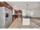 Well-equipped kitchen features stainless steel appliances, tile flooring, and ample counter space at 15810 Starling Water Dr, Lithia, FL 33547