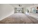 Spacious living room featuring a ceiling fan, large windows, and sliding glass doors at 15810 Starling Water Dr, Lithia, FL 33547