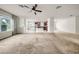 Spacious living room with an open layout connecting to the kitchen and dining area at 15810 Starling Water Dr, Lithia, FL 33547