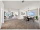 Open living space featuring a living room, dining area, and bar seating at 15810 Starling Water Dr, Lithia, FL 33547